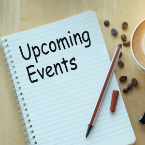 A notebook with a pen laying ontop and coffee next to it | Upcoming Events.