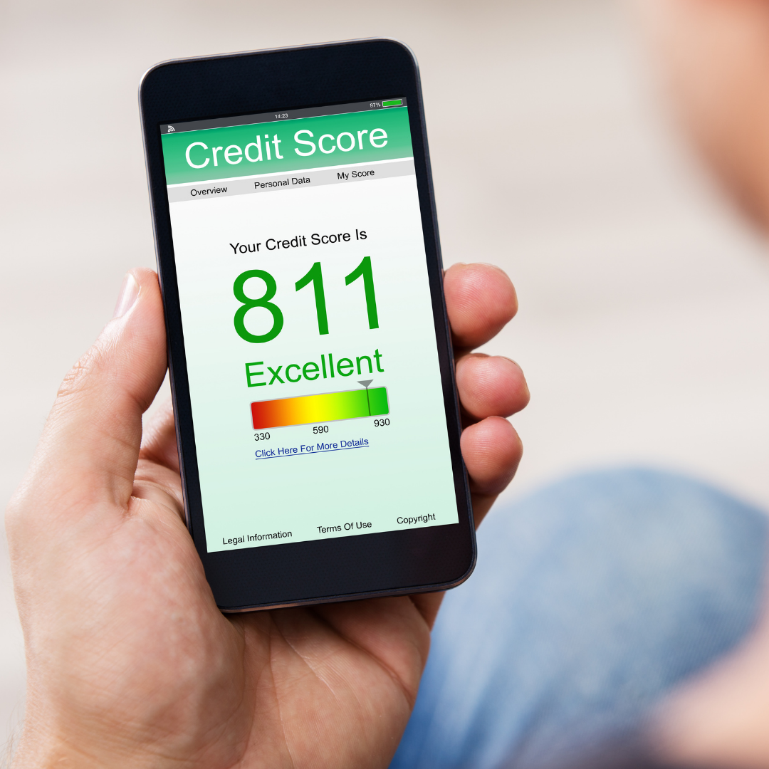 Person holding phone with credit score on it