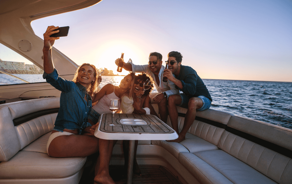 Group of friends taking a picture together on a boat
