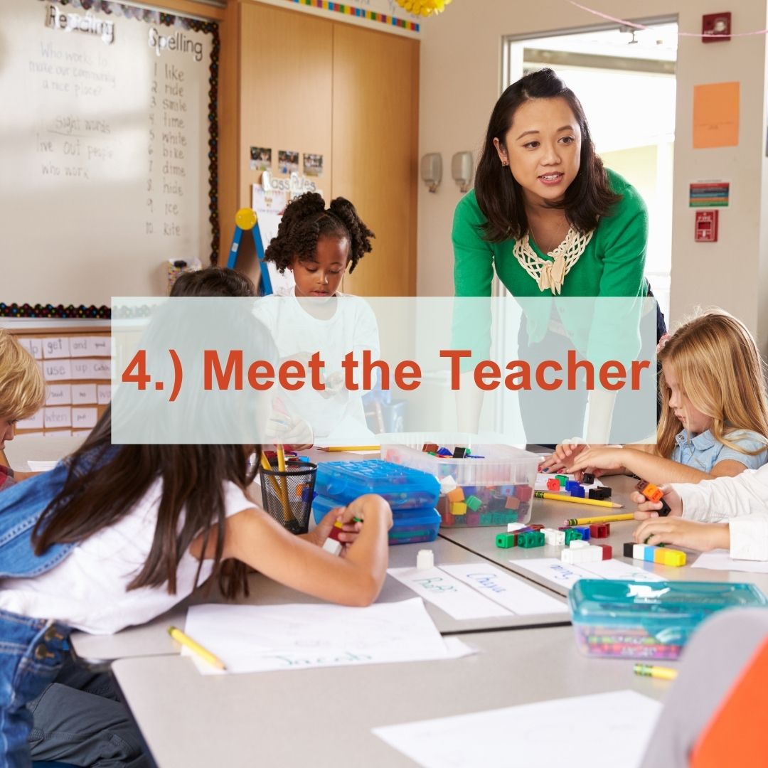 a teacher talking to students at desk | Meet The Teacher