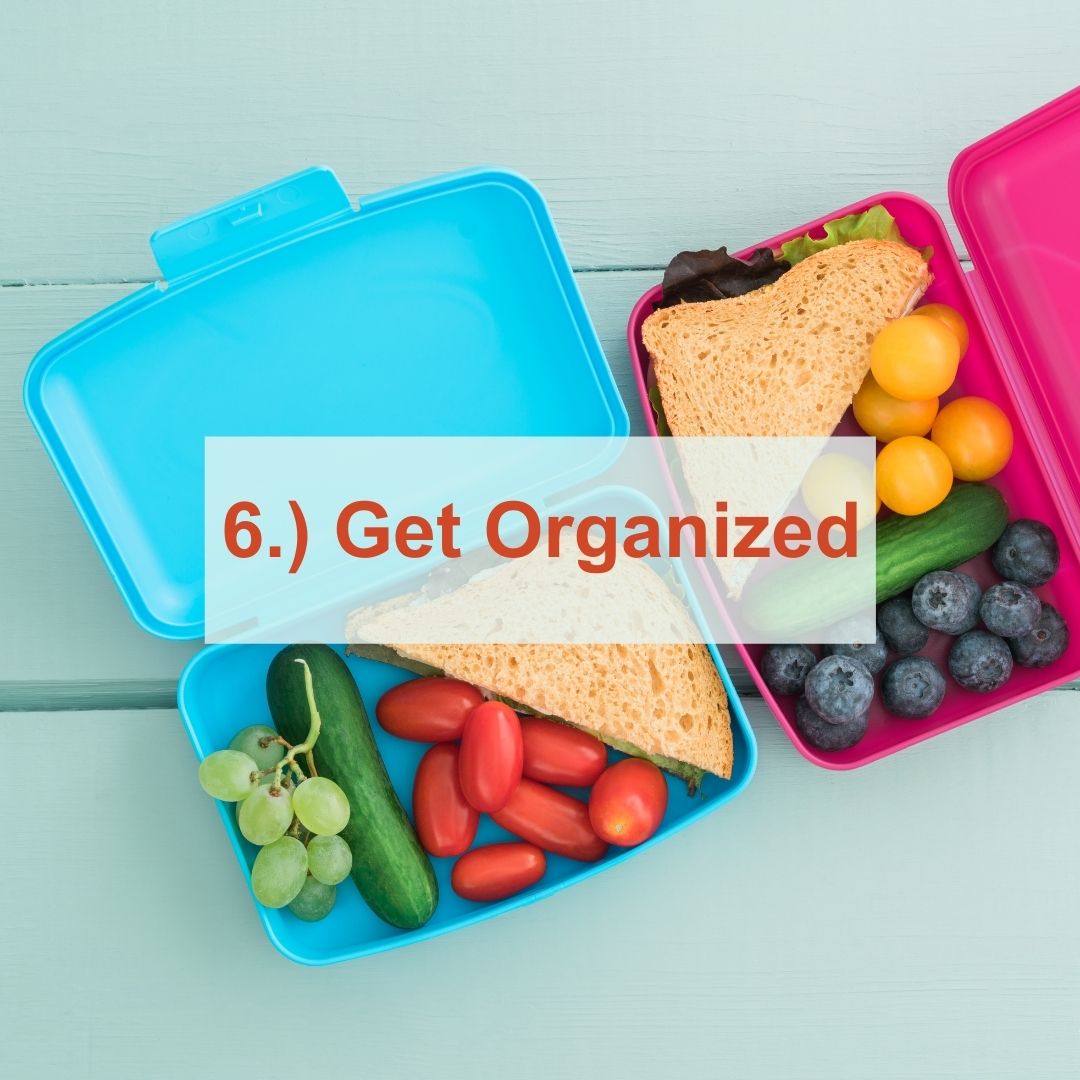A blue and pink lunchbox filled with health snacks | Get Organized