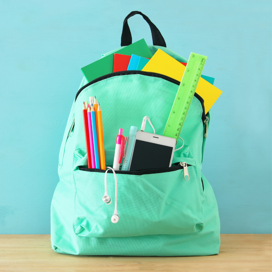 A teal backpack filled with school supplies