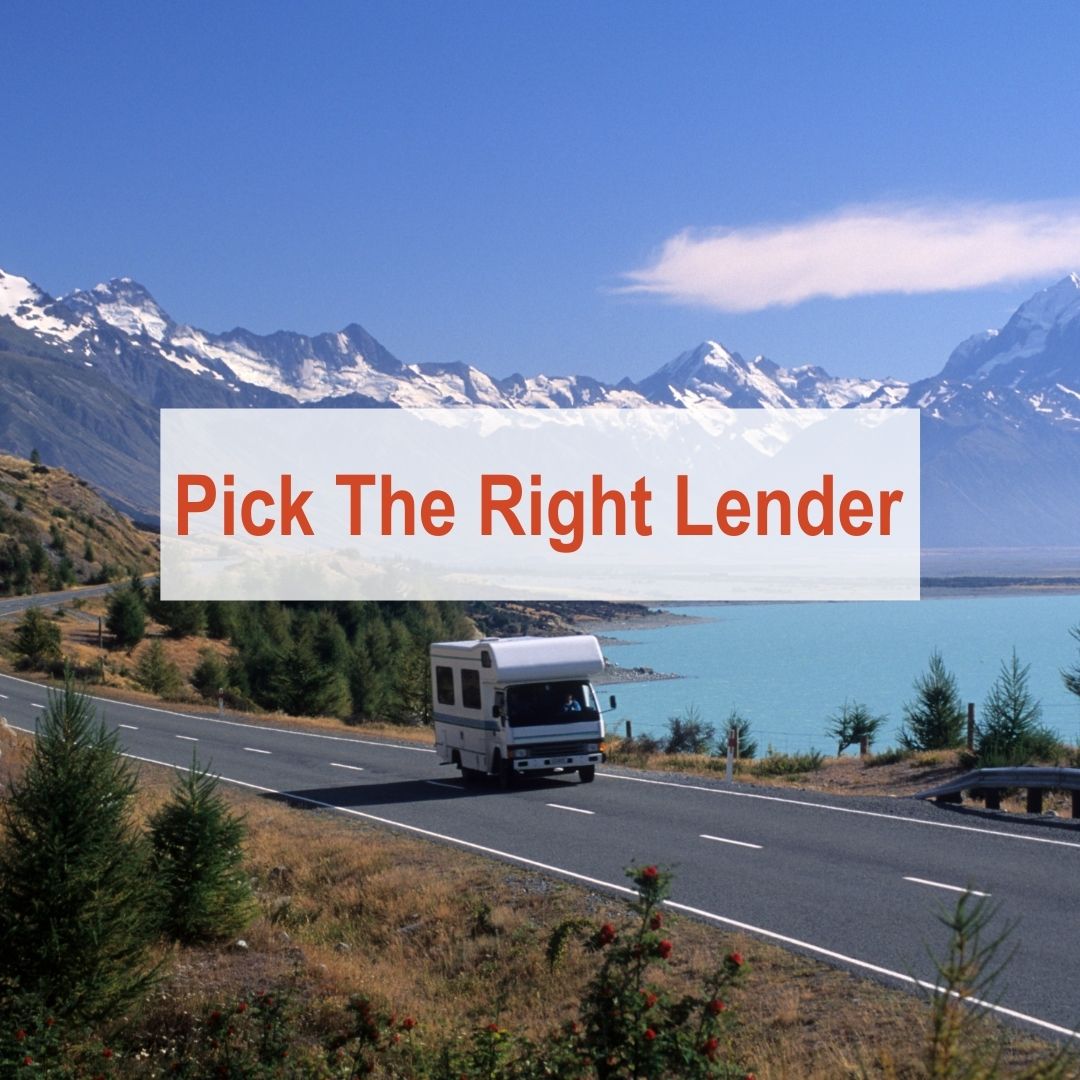 RV driving on a road next to a lake | Pick The Right Lender