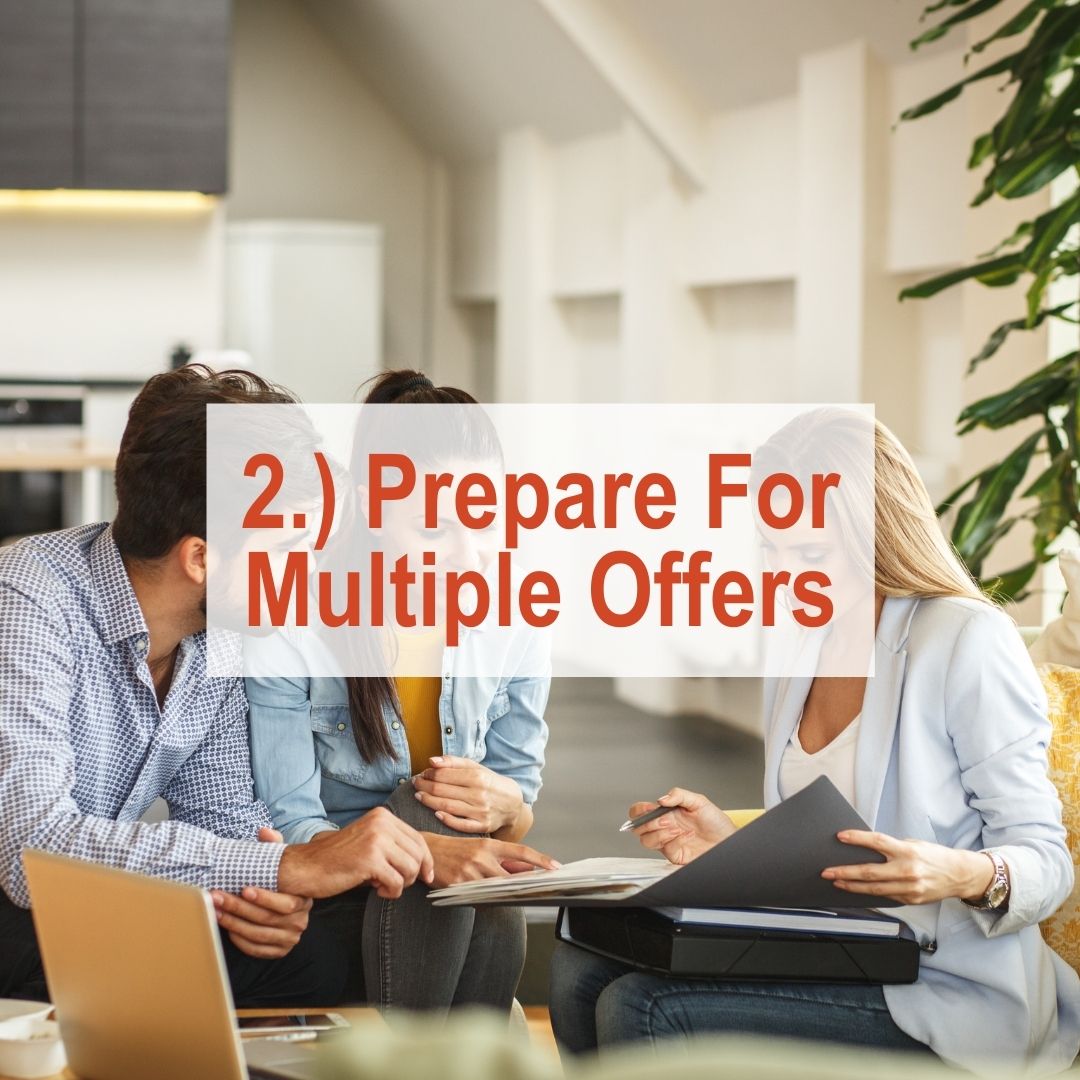 a couple sitting with real estate agent going over papers | Prepare For Multiple Offers