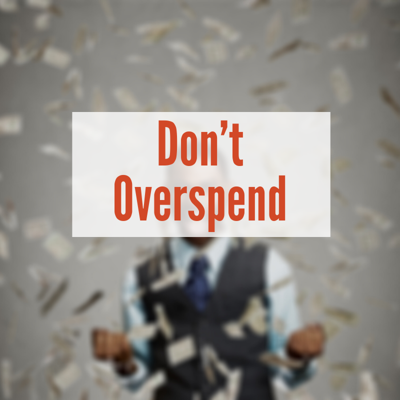 Person throwing money up | Don't Overspend